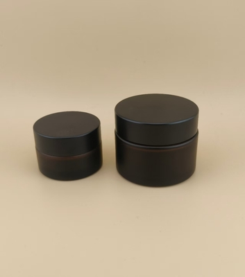 Vaso in crema con coperchio a vite per lozione, occhiali neri dal design accattivante