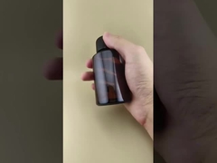 Design delicato, bottiglia rotonda liscia di vetro marrone trasparente con tappo speciale per medicinali