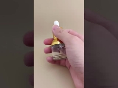 Bellissima bottiglia rotonda trasparente con contagocce per essenze