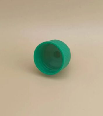 Tappo in plastica verde scanalato per flaconi di vernice