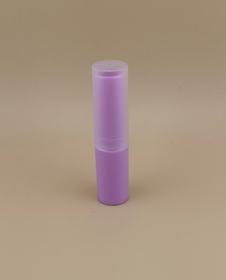 Confezione viola piccola per balsamo labbra con coperchio trasparente scanalato per rossetti