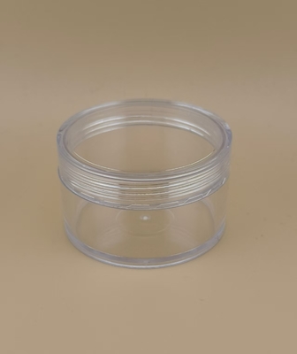 Vasetto di crema trasparente in plastica con coperchio a vite per cosmetici