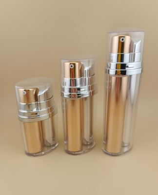 Bottiglia di pompa senza aria a due colori dorata e argentina con rivestimento esterno per prodotti cosmetici e per la cura della pelle