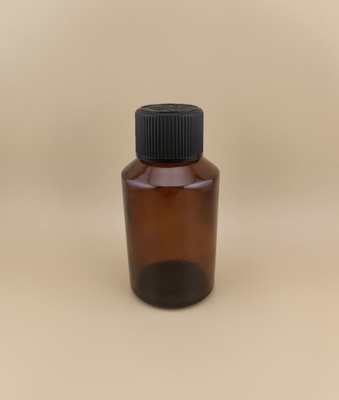 Design delicato, bottiglia rotonda liscia di vetro marrone trasparente con tappo speciale per medicinali