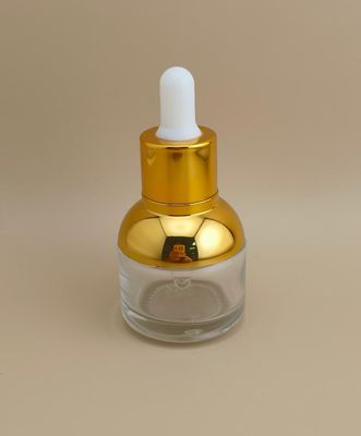 Bellissima bottiglia rotonda trasparente con contagocce per essenze